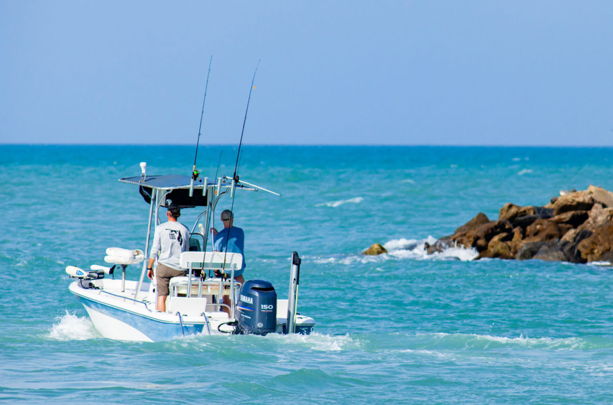 people boating and enjoying their southeast waterfront property in venice, florida