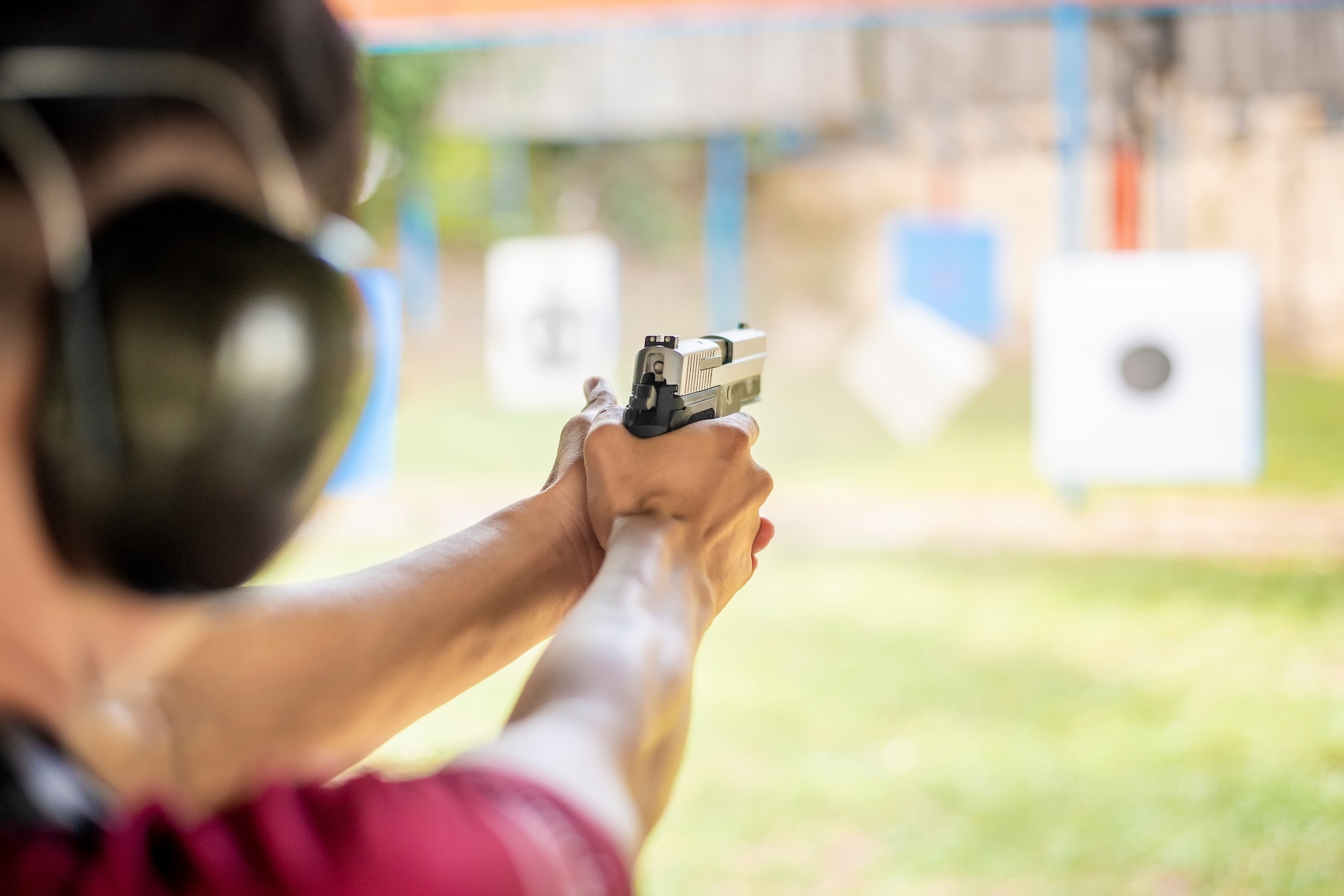 A man practicing shooting a gun