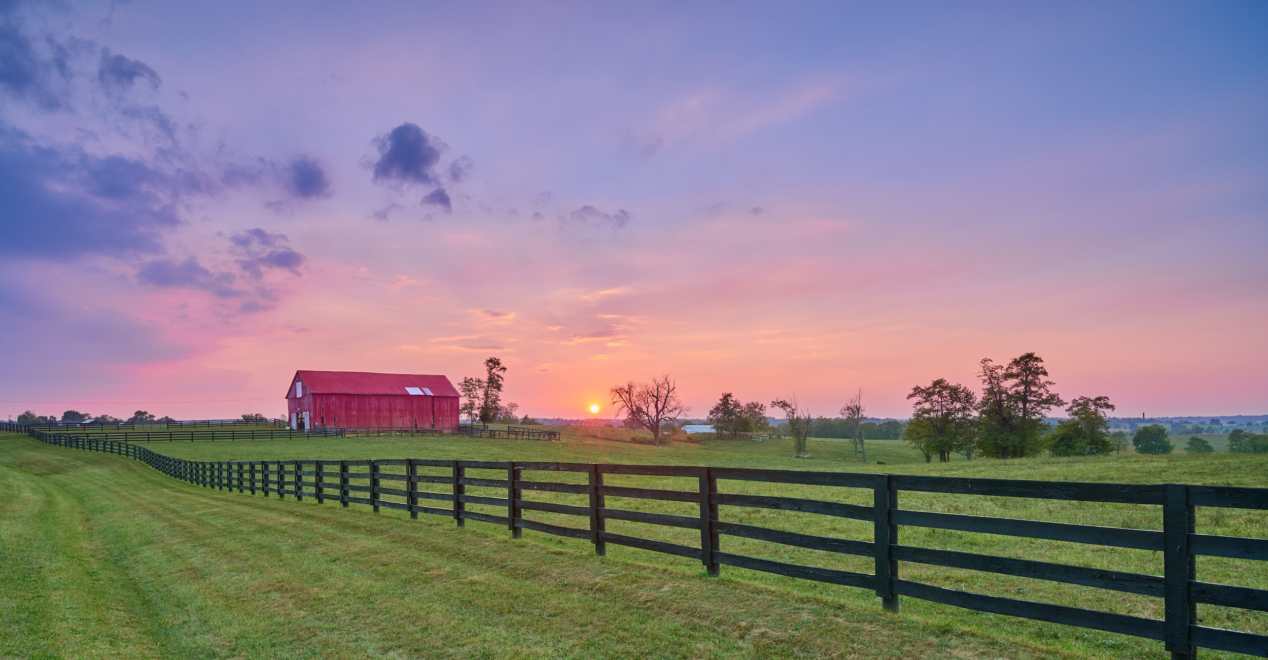 rural farm property with a red barn purchased through a land loan