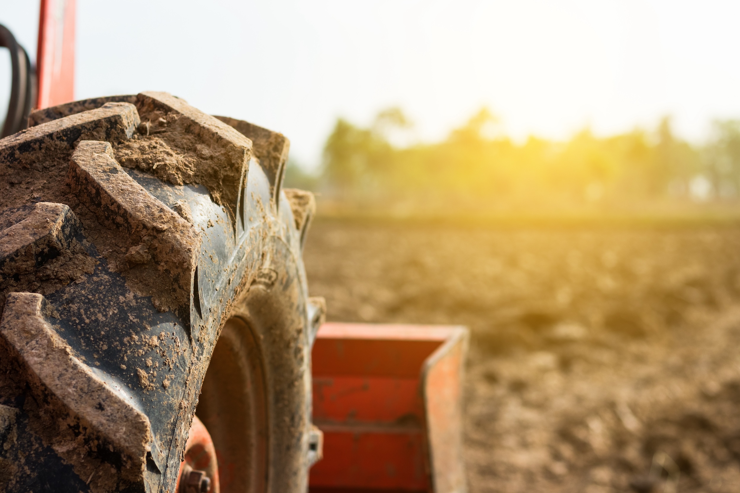 muddy tire on an electric farm tractor