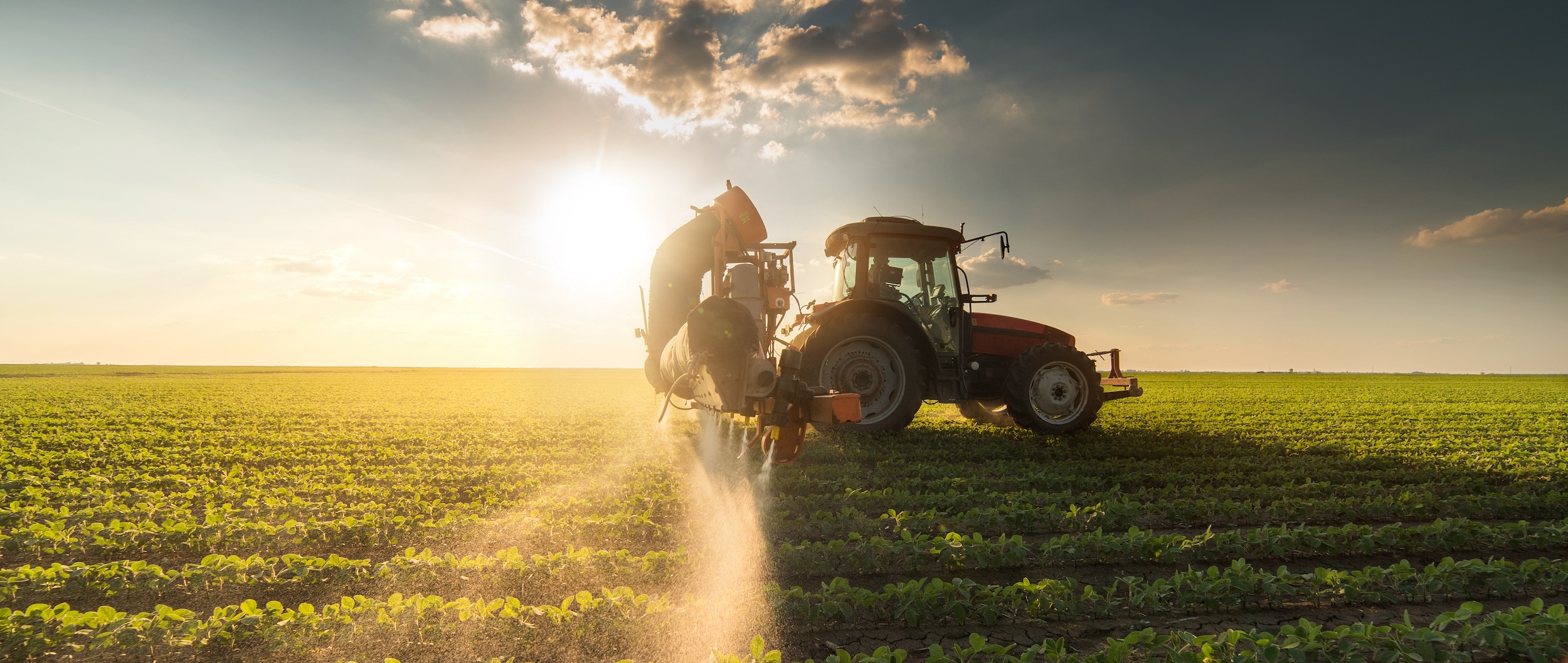 a mid tier priced tractor watering plants on a farm