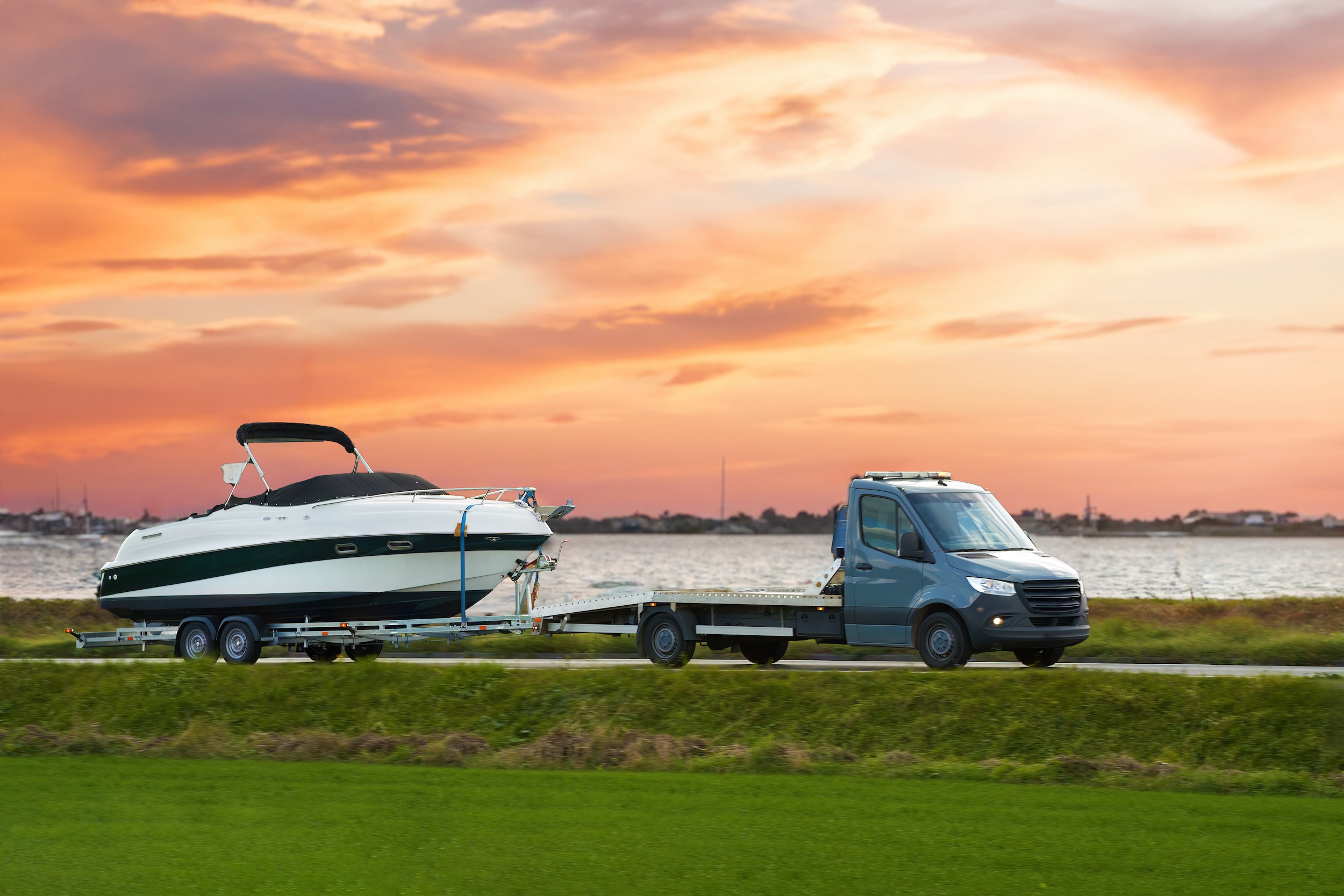 truck using a semi trailer to tow a boat