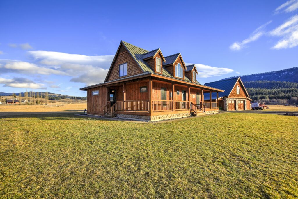 cabin style house with a large front porch built on ranch land where the owner knew how to find their property lines with a survey before purchase