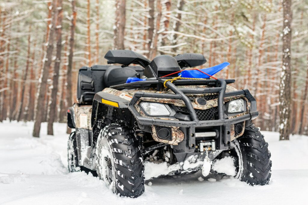 atv in the snow in a forest