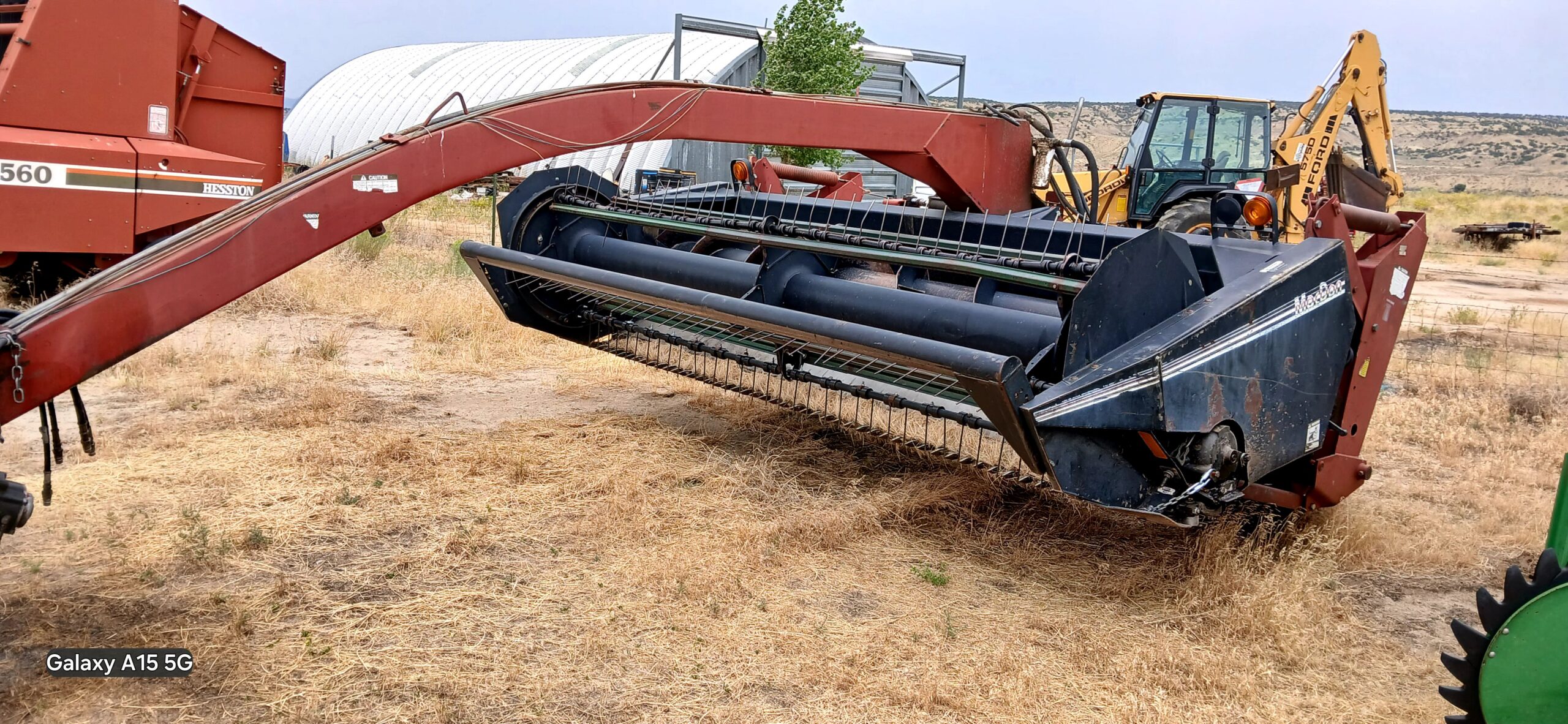 Thumbnail image of a MacDon Model 5000 Power-Tongue Windrower/Swather.