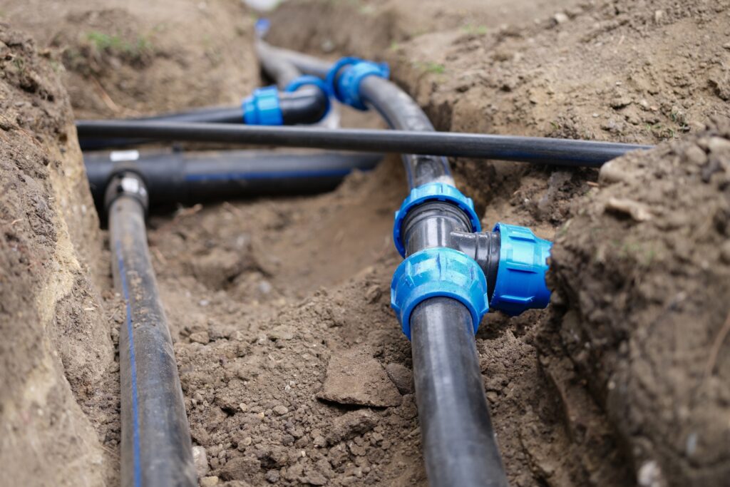 underground installation of a drip irrigation system for an agricultural operation
