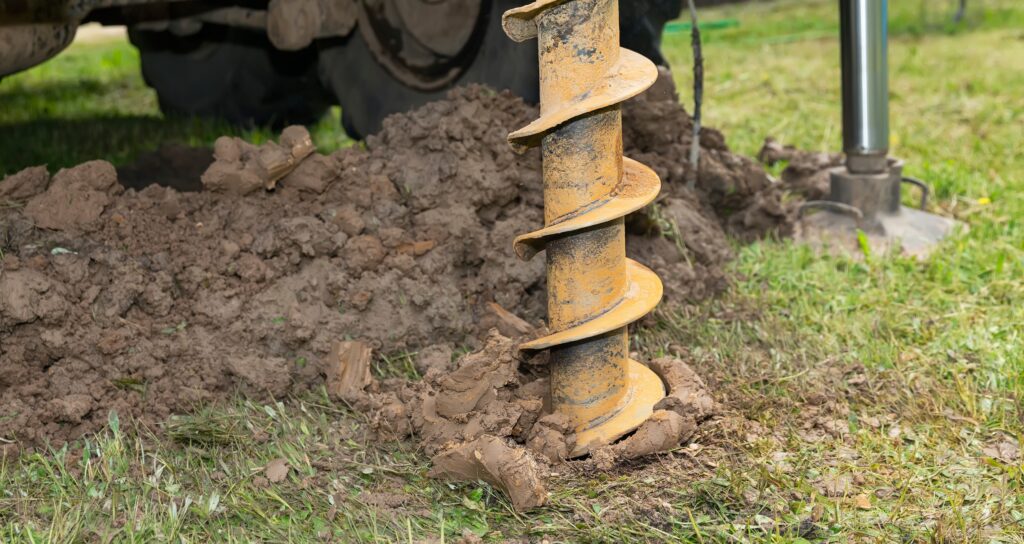 drill drilling into a plot of land